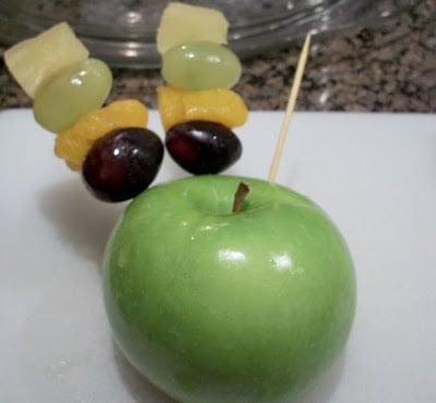 Apple with grapes, oranges and pineapple
