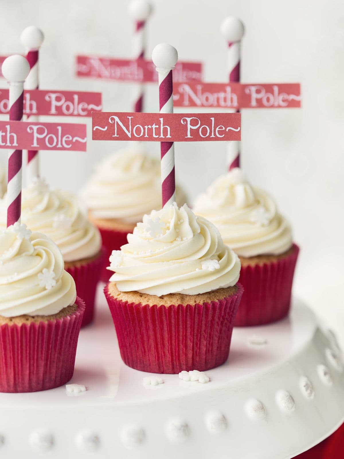 north pole cupcakes on a white tray