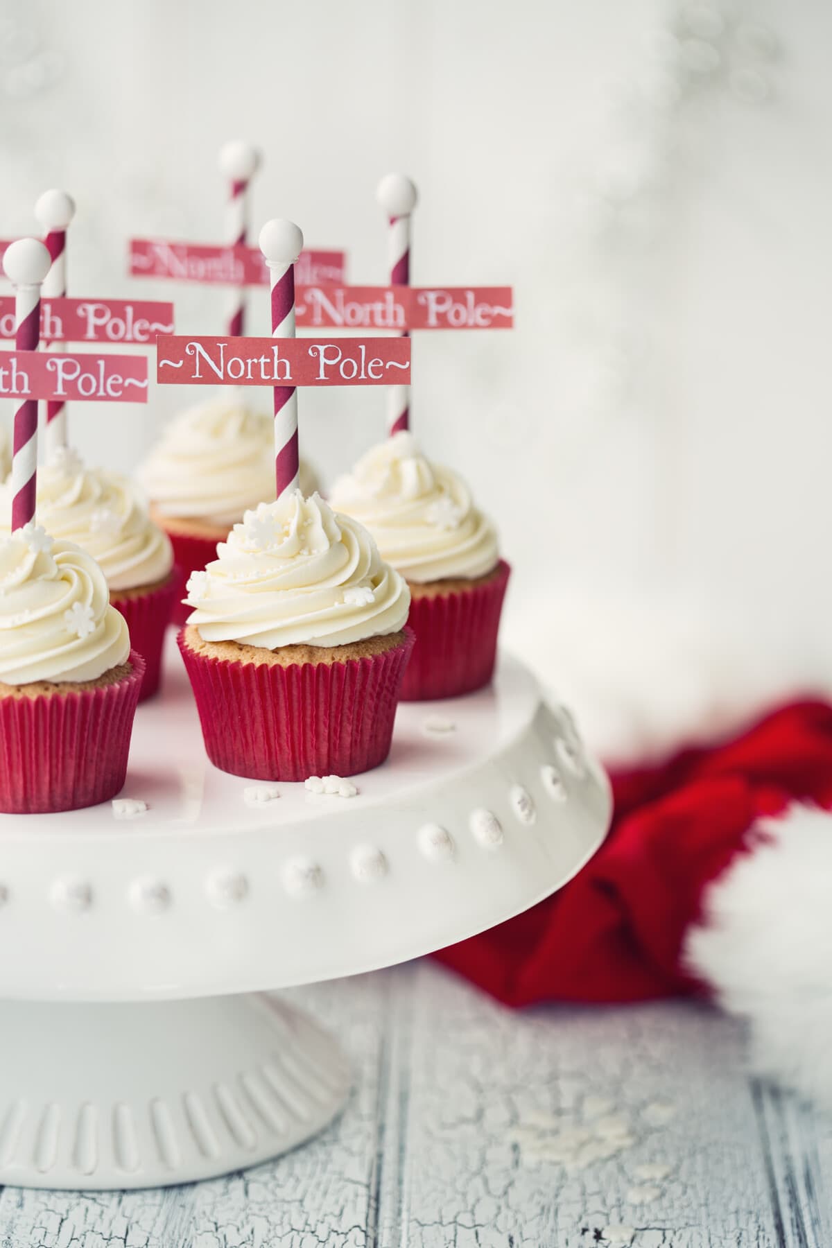 north pole cupcakes on a white stand