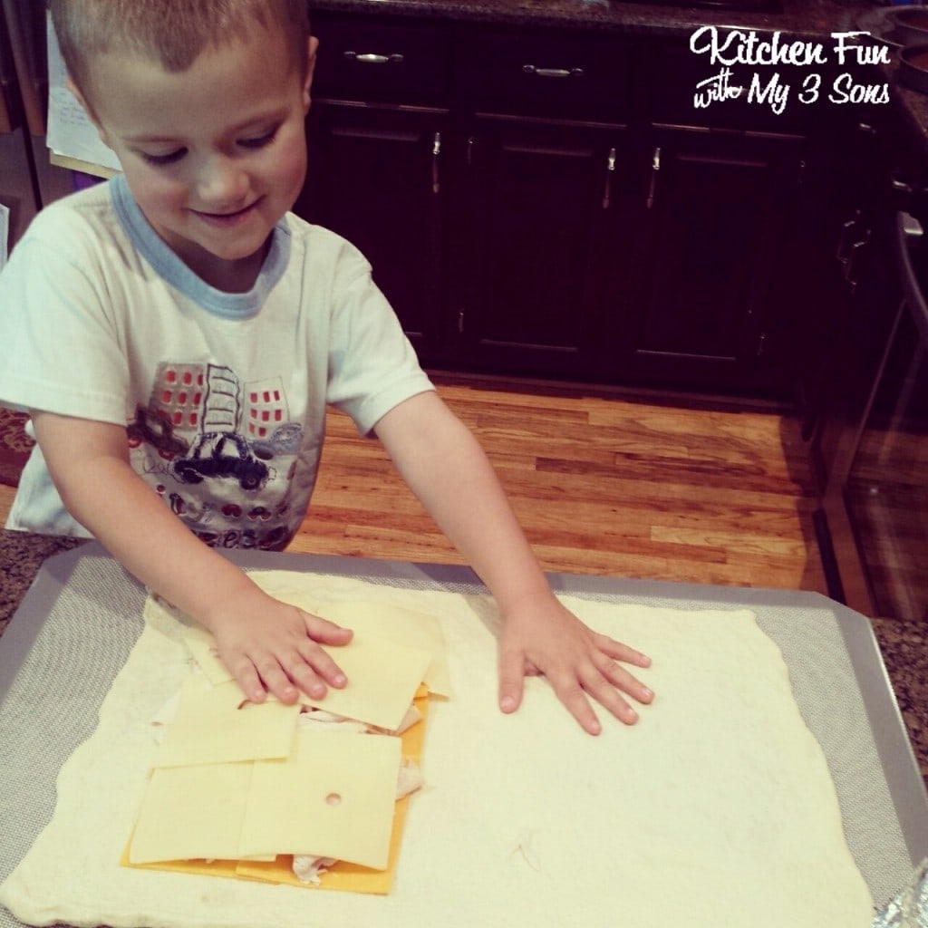 We roll out Pillsbury thin pizza crust & top by laying turkey & cheeses on one side. Fold the other side over & press the edges with a fork
