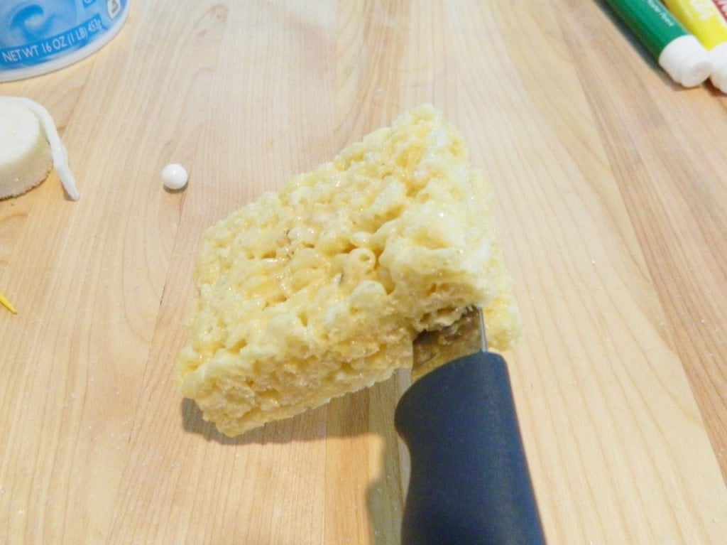 Start out by cutting the Rice Krispies Treats a little more than half way using a knife