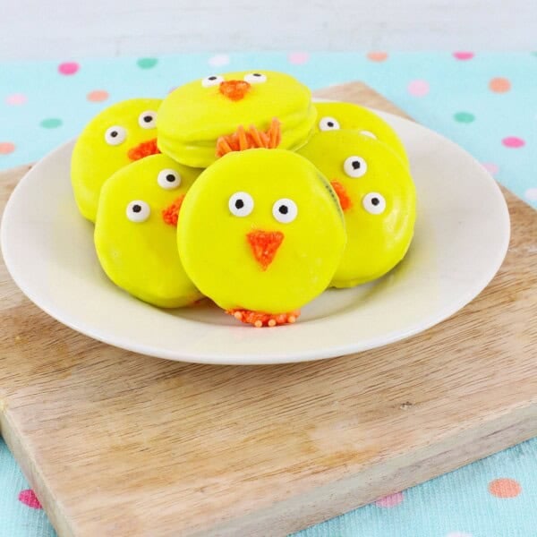 Oreo Easter Chick Cookies on a wooden board.