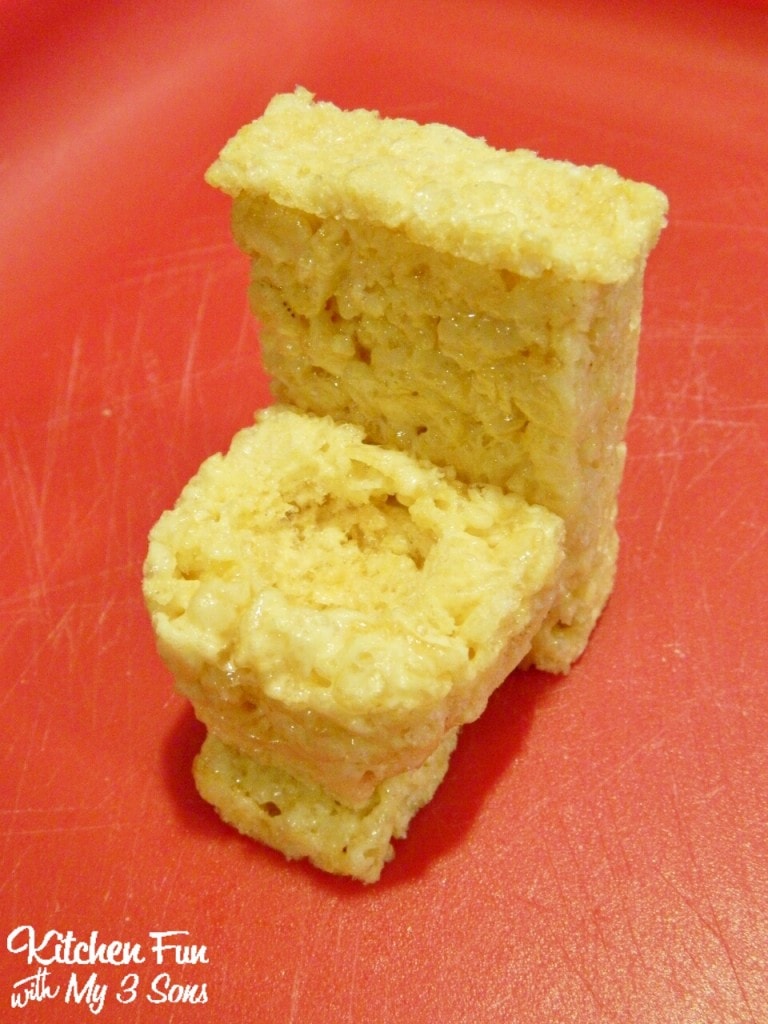Press around the edges into the shape of a toilet & then press up against the other Rice Krispies Treat