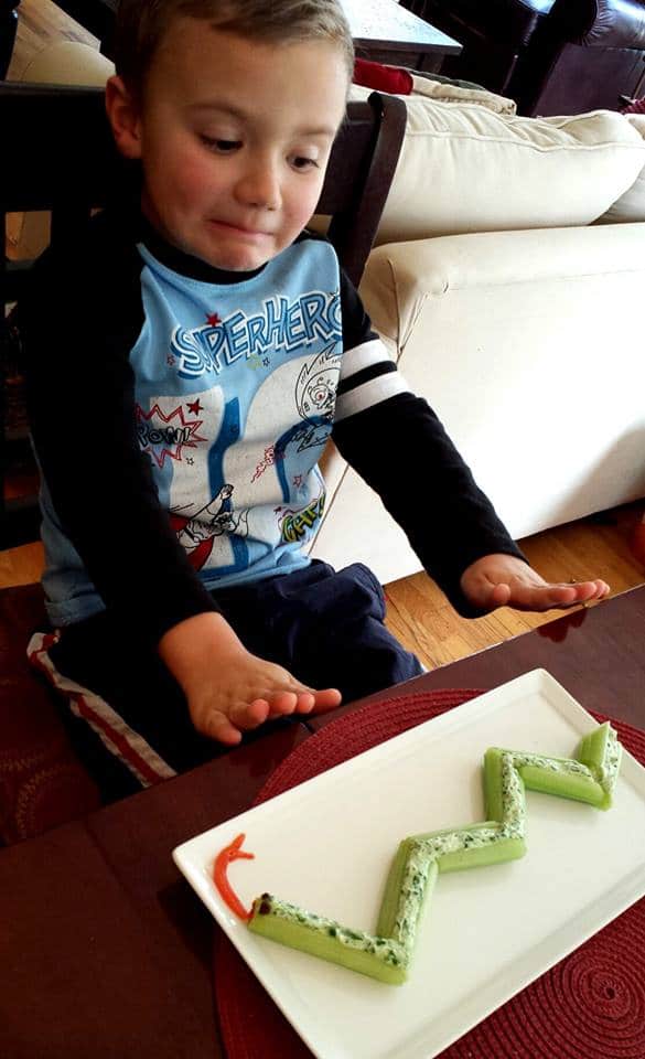 Celery Snake Snack...a great way to get the kids to eat a healthy afternoon snack! KitchenFunWithMy3Sons.com
