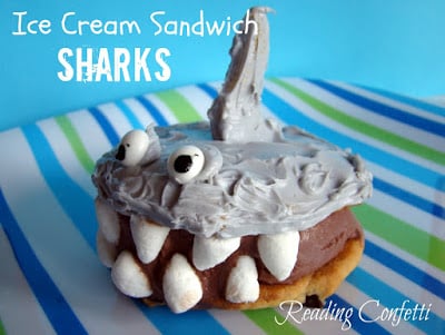 An ice cream sandwich decorated to look like a shark with big marshmallow teeth