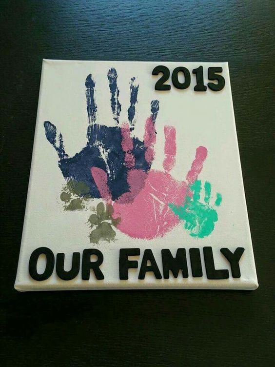 Our Family Handprints on Canvas Art including Puppy prints...so cute!