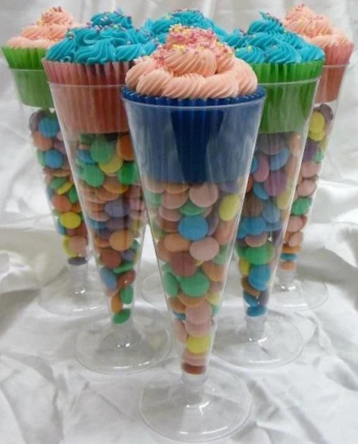 Cupcakes and candy in champagne plastic cups