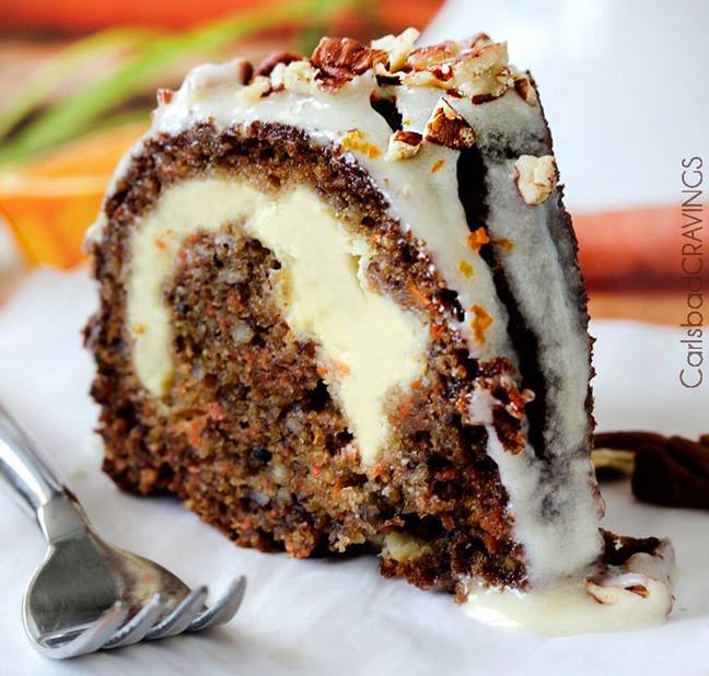 Cream Cheese Stuffed Carrot Bundt Cake Topped with Orange Glaze and Chopped Nuts