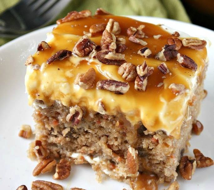 A square of Sea Salt Caramel & Carrot Poke Cake  on a white plate.