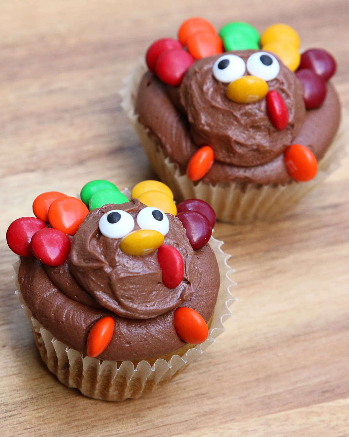 Turkey Cupcakes on a wooden table.