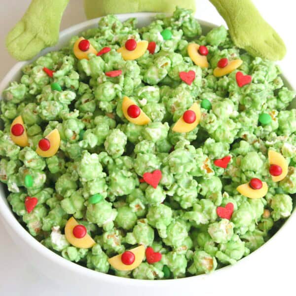 grinch popcorn in a white bowl