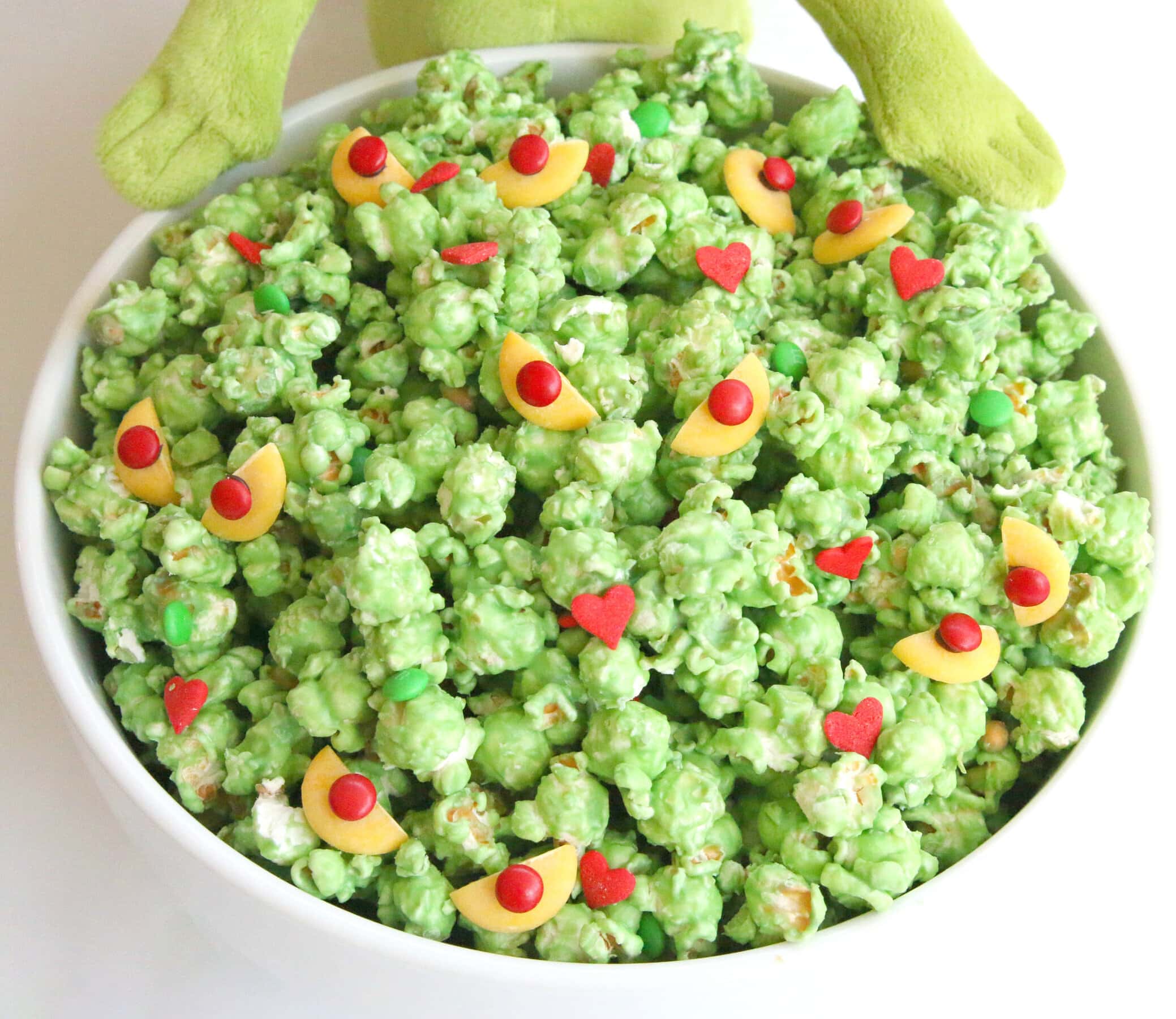 grinch popcorn in a white bowl