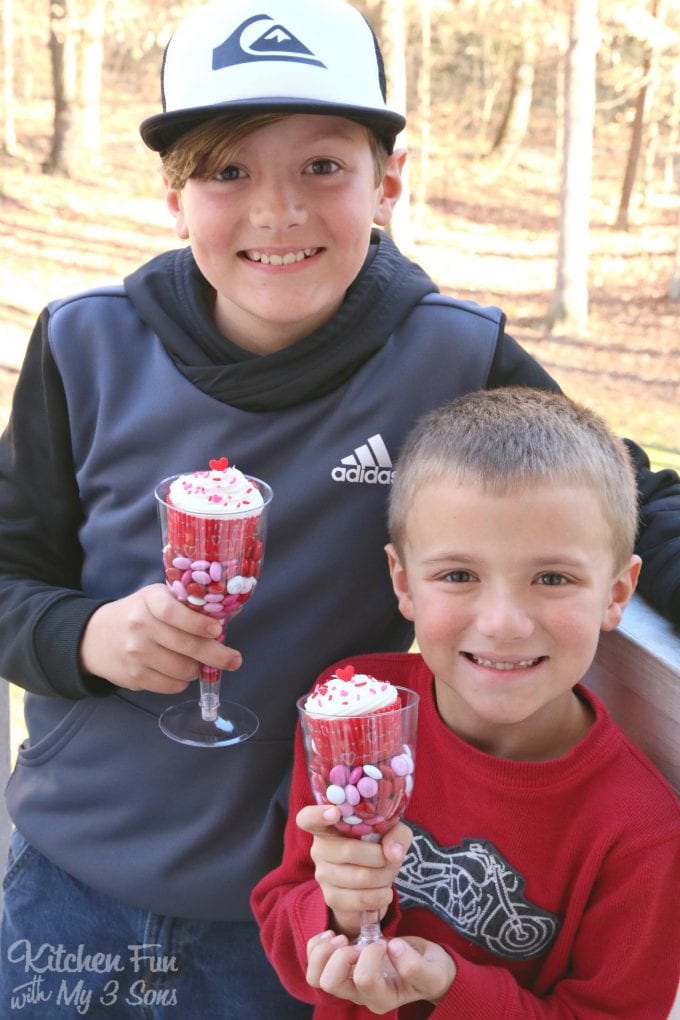Valentine Cupcakes served in Plastic Wine Glasses filled with Candy! Such a fun idea for the Kids for Valentine's Day!
