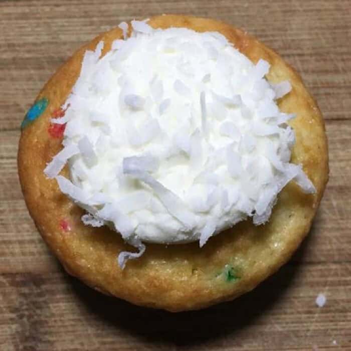 Bunny Butt Cupcakes are the cutest Easter treat and loved by kids and adults! adding coconut to the white frosting on the cupcake