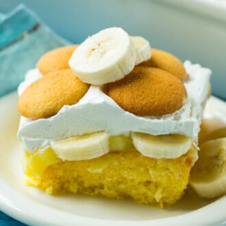 Banana Pudding Poke Cake slice on a plate