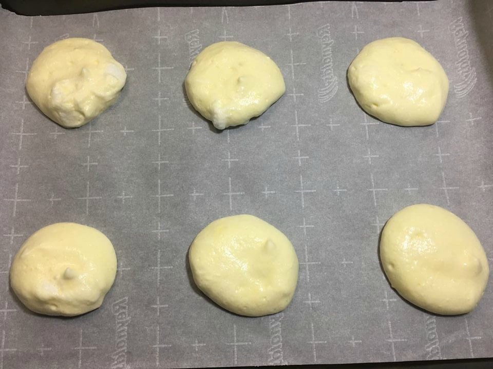 unbaked cloud bread batter on a cookie sheet
