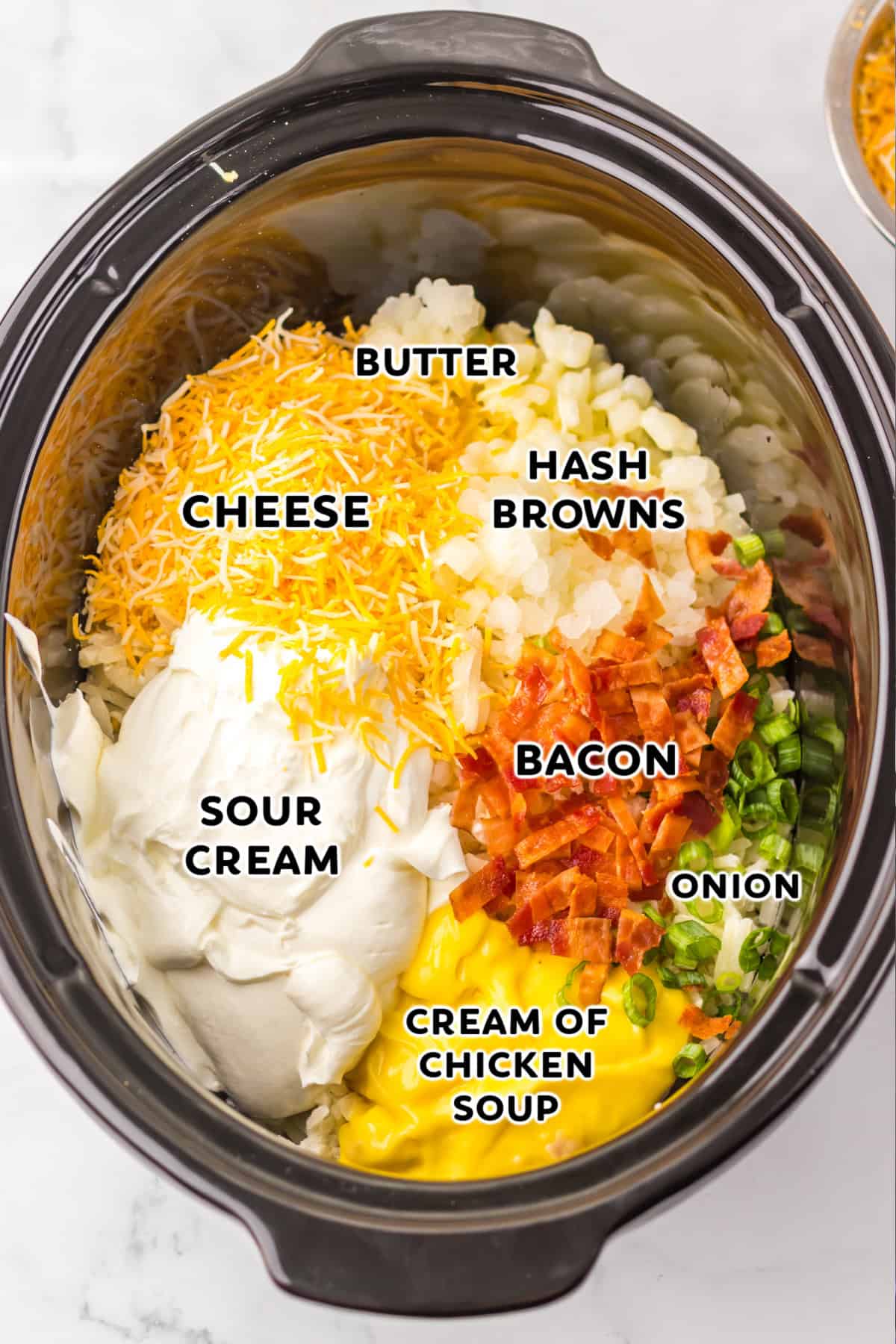 Loaded Hashbrown Casserole ingredients in a crockpot