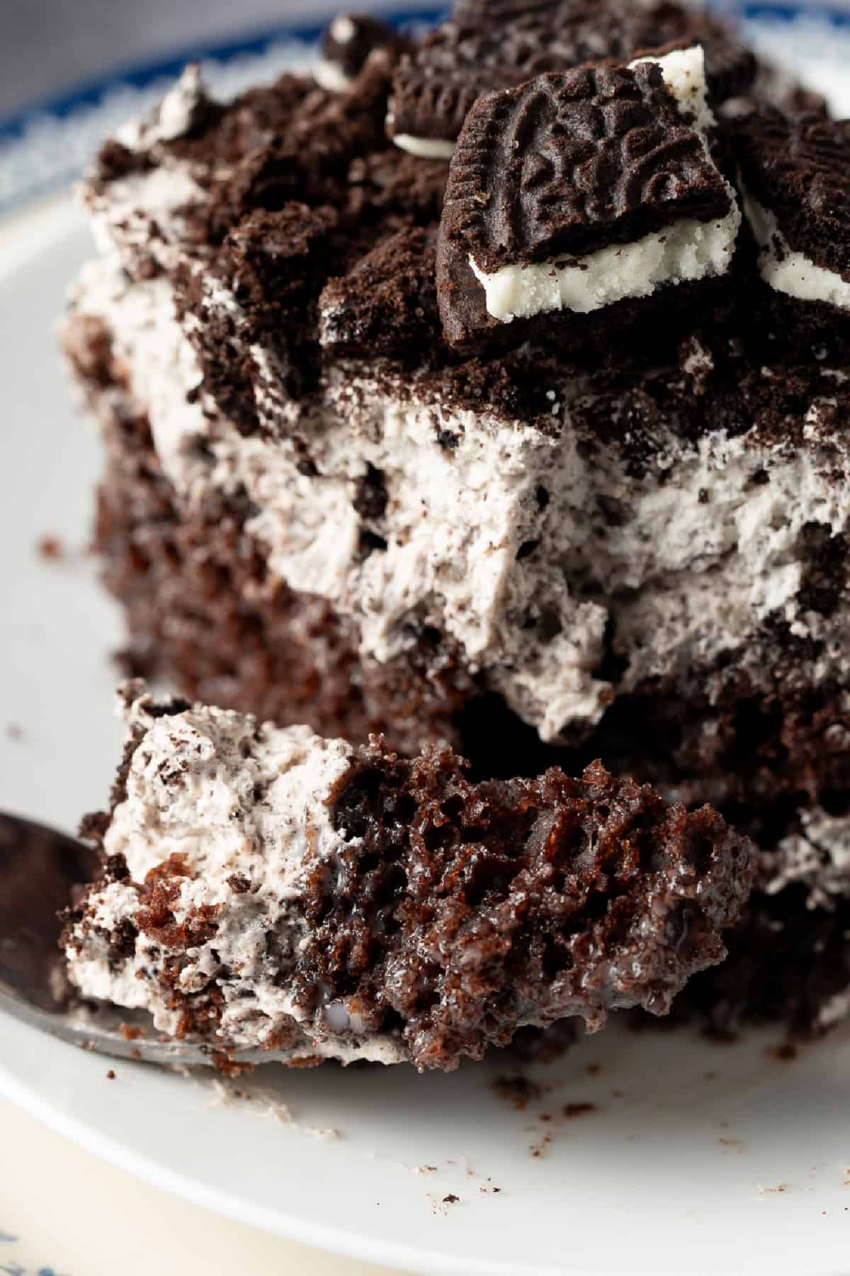 Oreo Poke Cake Slice with a fork