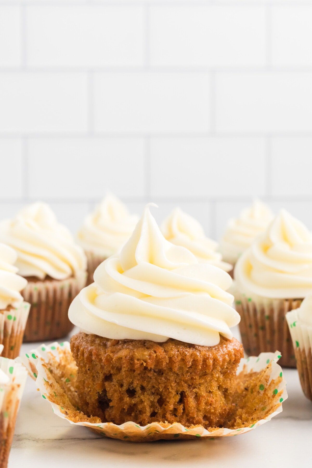 Carrot Cake Cupcakes on a table.