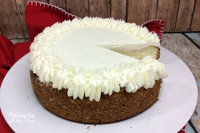 New York Cheesecake on a white plate with a slice missing