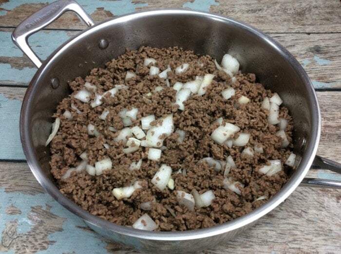 ground beef and onions in a pan