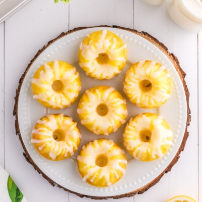 Mini Lemon Bundt Cakes on a plate on a wooden platter.