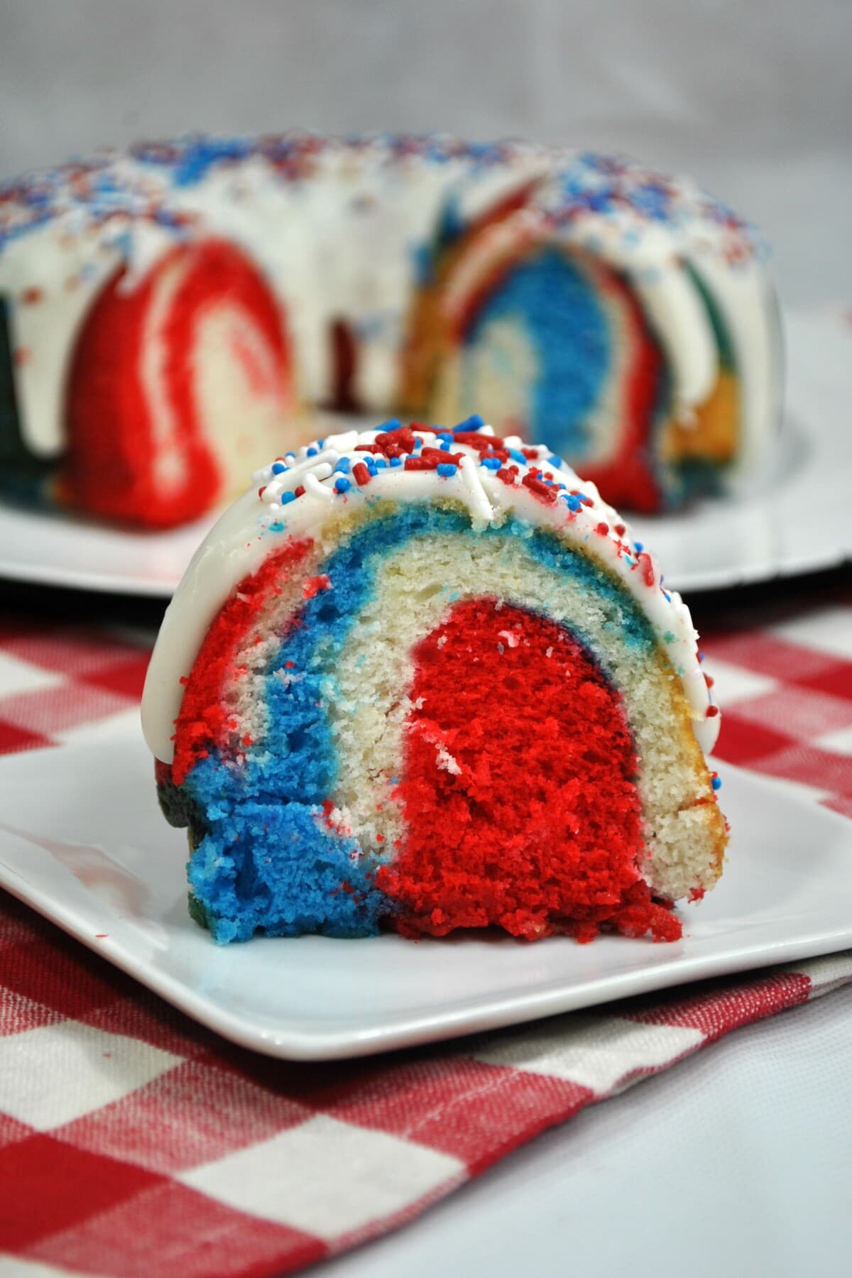 red white and blue cake on a white plate