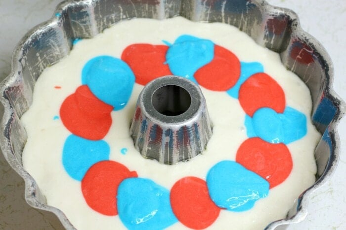 adding the colored batter to the white batter