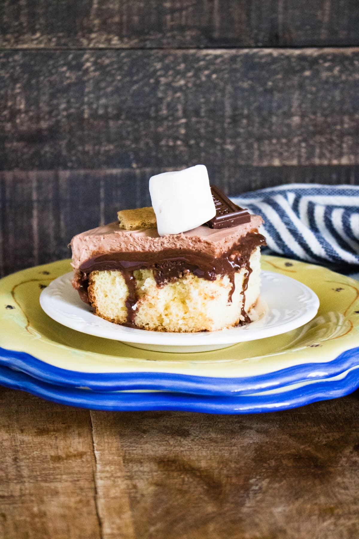 A piece of the S'mores Poke Cake.