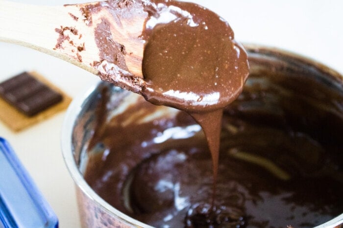 Pouring the chocolate topping.