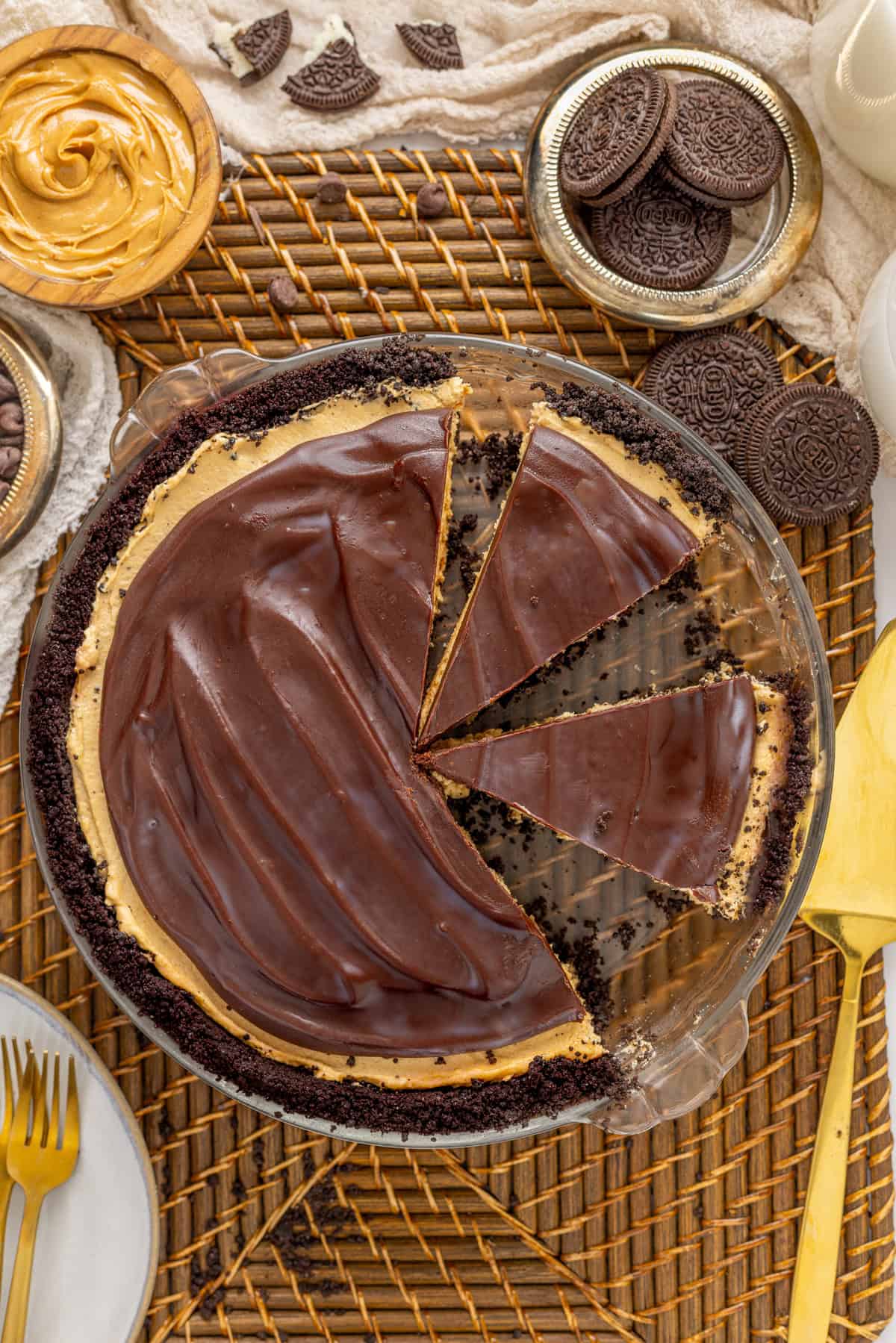 Overhead view of a no bake chocolate peanut butter pie with one slice being served