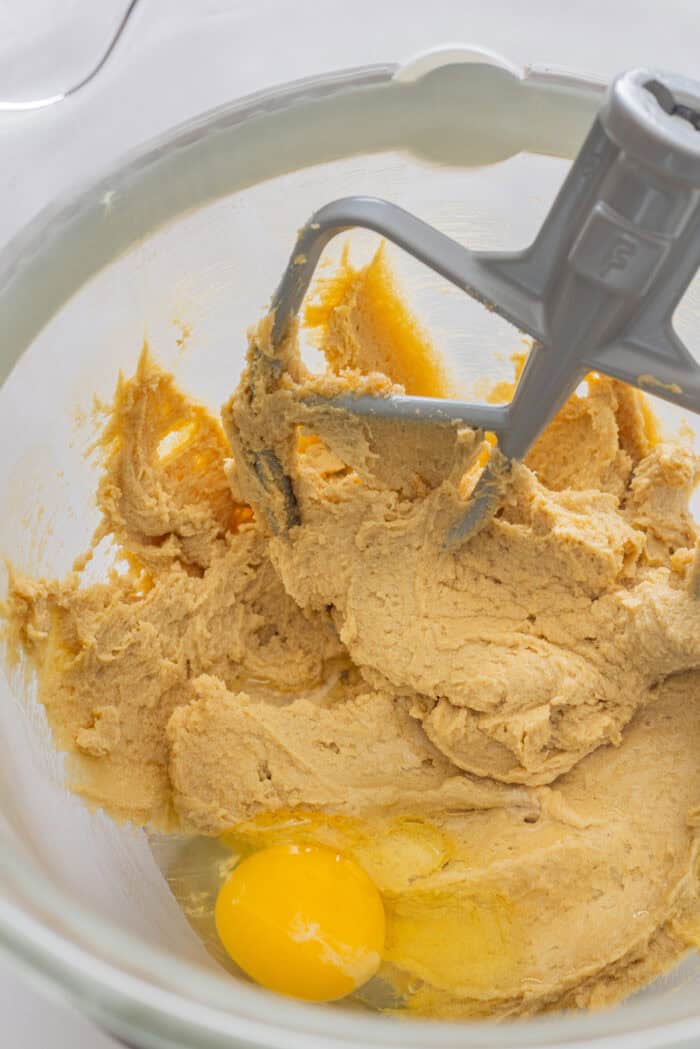 Adding egg to creamed butter and sugar