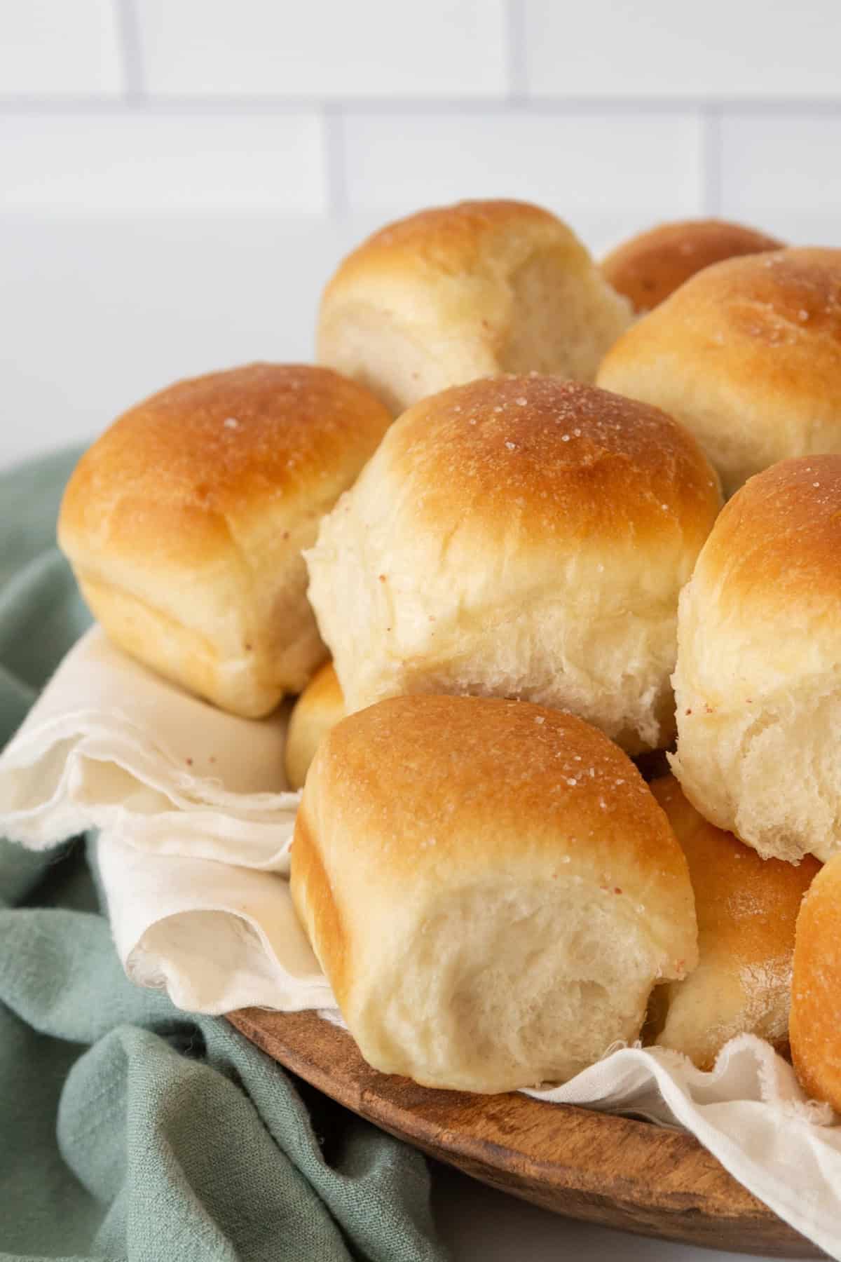 These fluffy 30 Minute Dinner Rolls are the perfect accompaniment to any meal. 30 minute dinner rolls in a basket