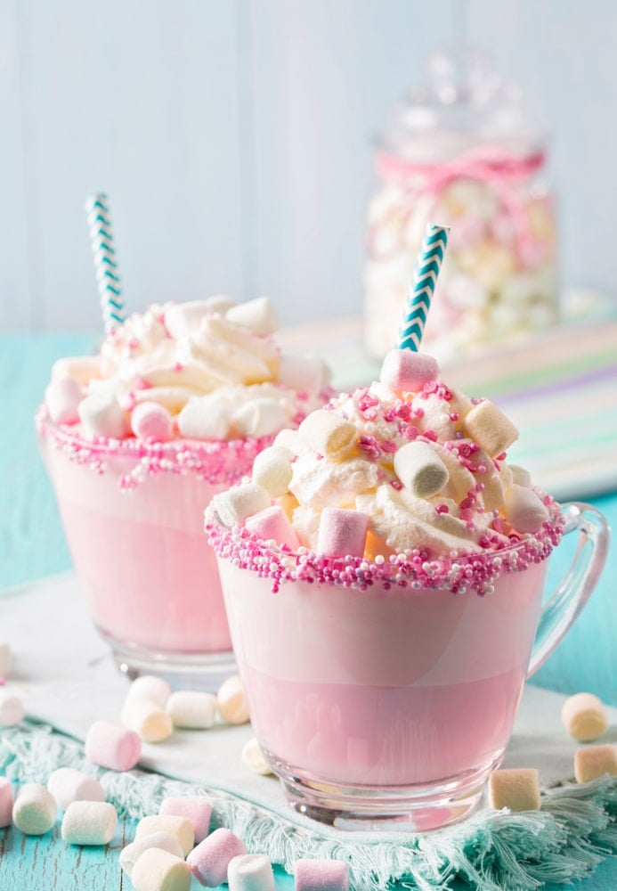 Two cups of sugar plum fairy white chocolate cocoa.
