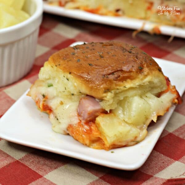 These Hawaiian pizza sliders recipe is one of my favorite easy dinners with chunks of ham and pineapple on sweet rolls.