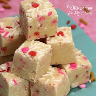This Valentine's Day cake batter fudge recipe full of pink and red sprinkles tastes like a mini vanilla cake!