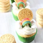 These Easy St. Patrick's Day Cupcakes are the cutest things ever. Add a golden Oreo, marshmallows and rainbow candy to make a simple and yummy holiday treat.