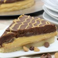 This Peanut Butter Pie recipe is inspired by our love of the Tagalong Girl Scout cookies. With one thick layer of peanut butter and one layer of delicious chocolate ganache, you will love this dessert!
