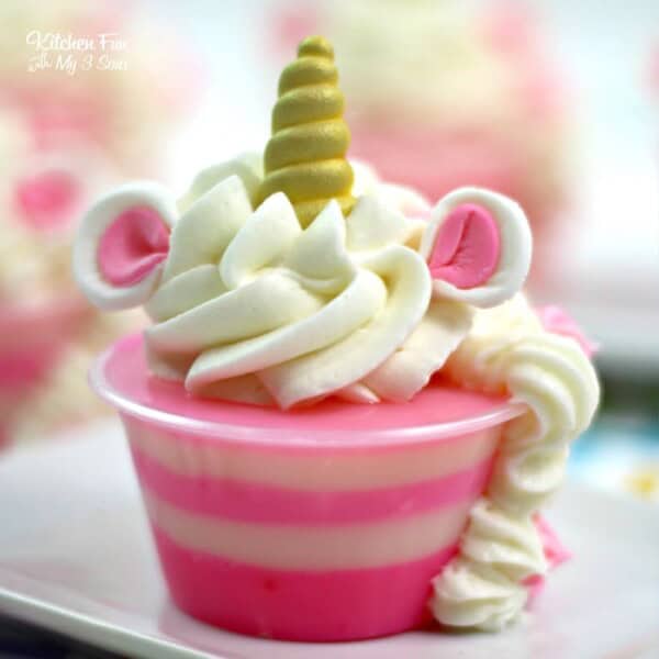 How fun are these Unicorn Jello Shots? Raspberry Jello with Bubble Gum Vodka and homemade whipping cream makes a pretty delicious treat for the grown-ups.