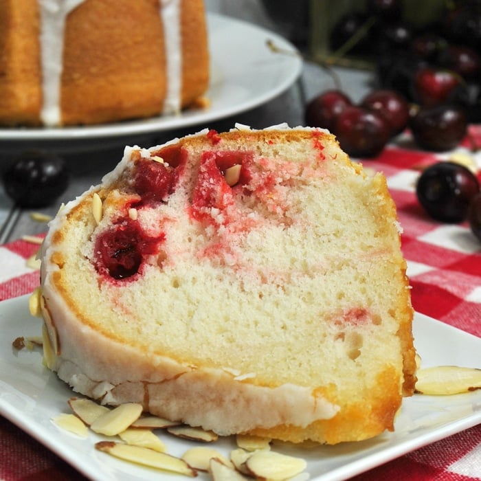 This Cherry Almond Bundt Cake recipe has a rich almond and vanilla flavor and loaded with delicious maraschino cherries. It's a great dessert for any occasion.