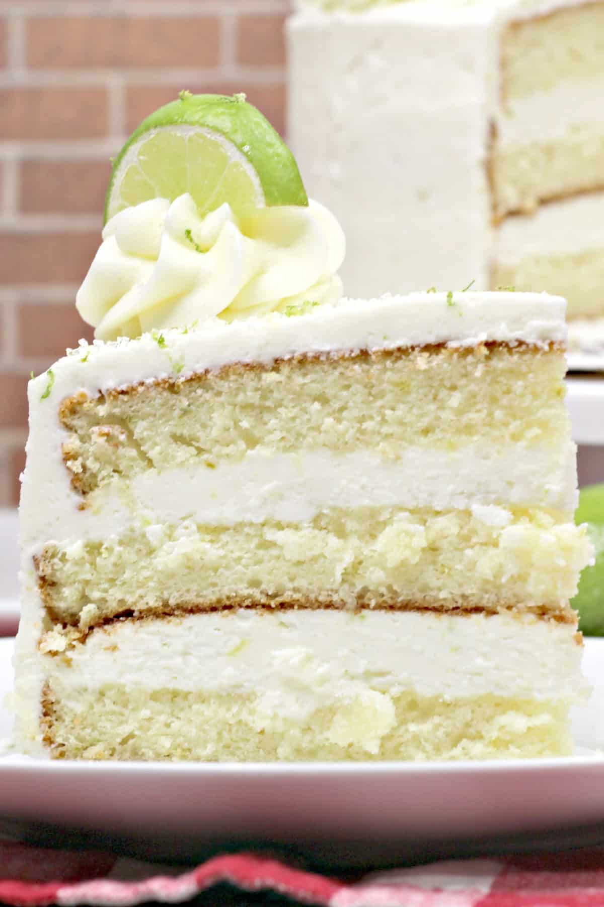 A slice of margarita cake on a white plate