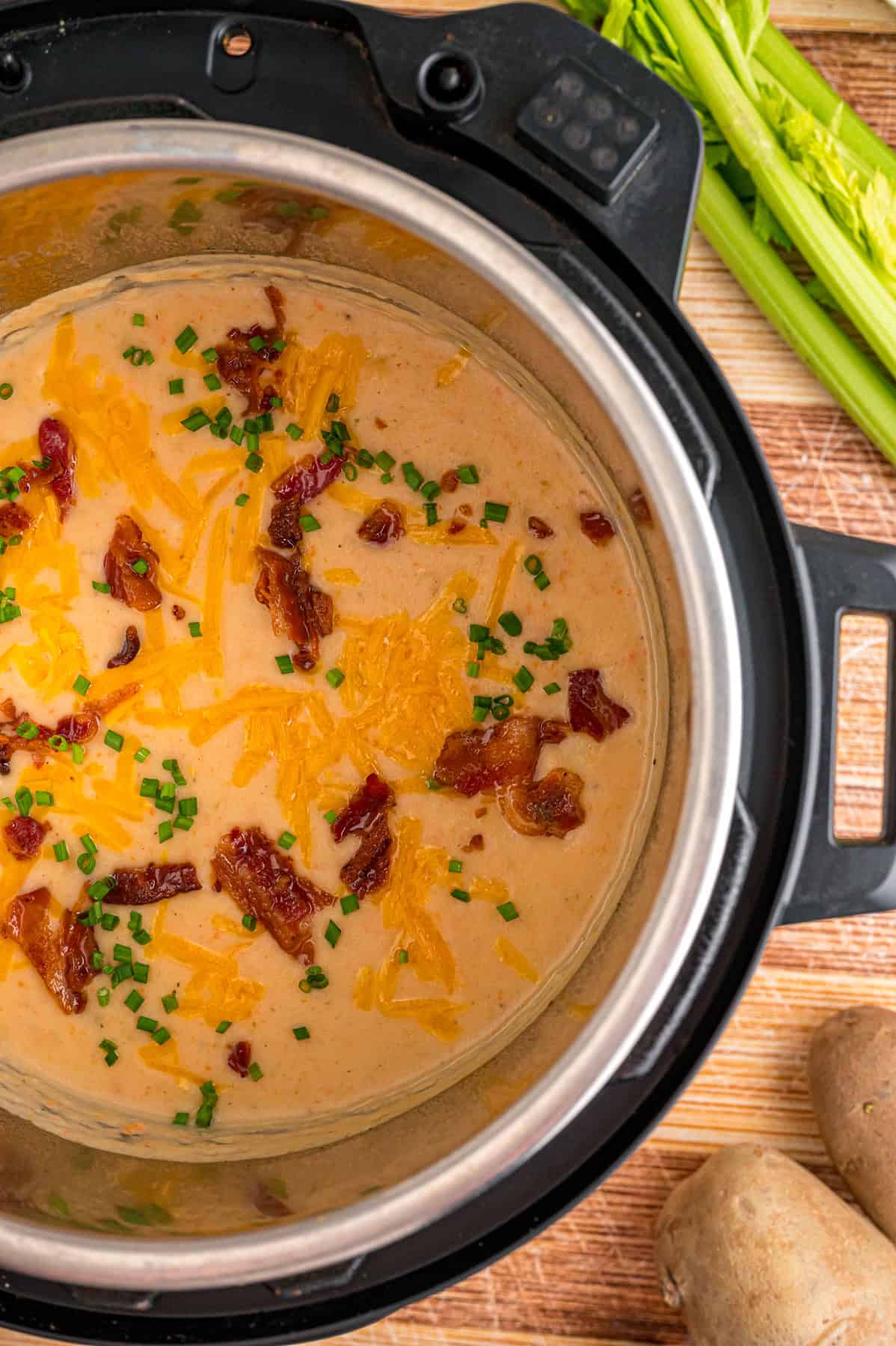 With a creamy base and tender chunks of potato in every bite, this Instant Pot Potato Soup comes together in just 45 minutes. Overhead view of potato soup in the instant pot