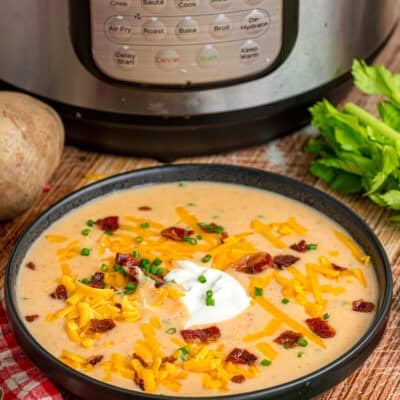 A bowl of potato soup in front of the Instant Pot