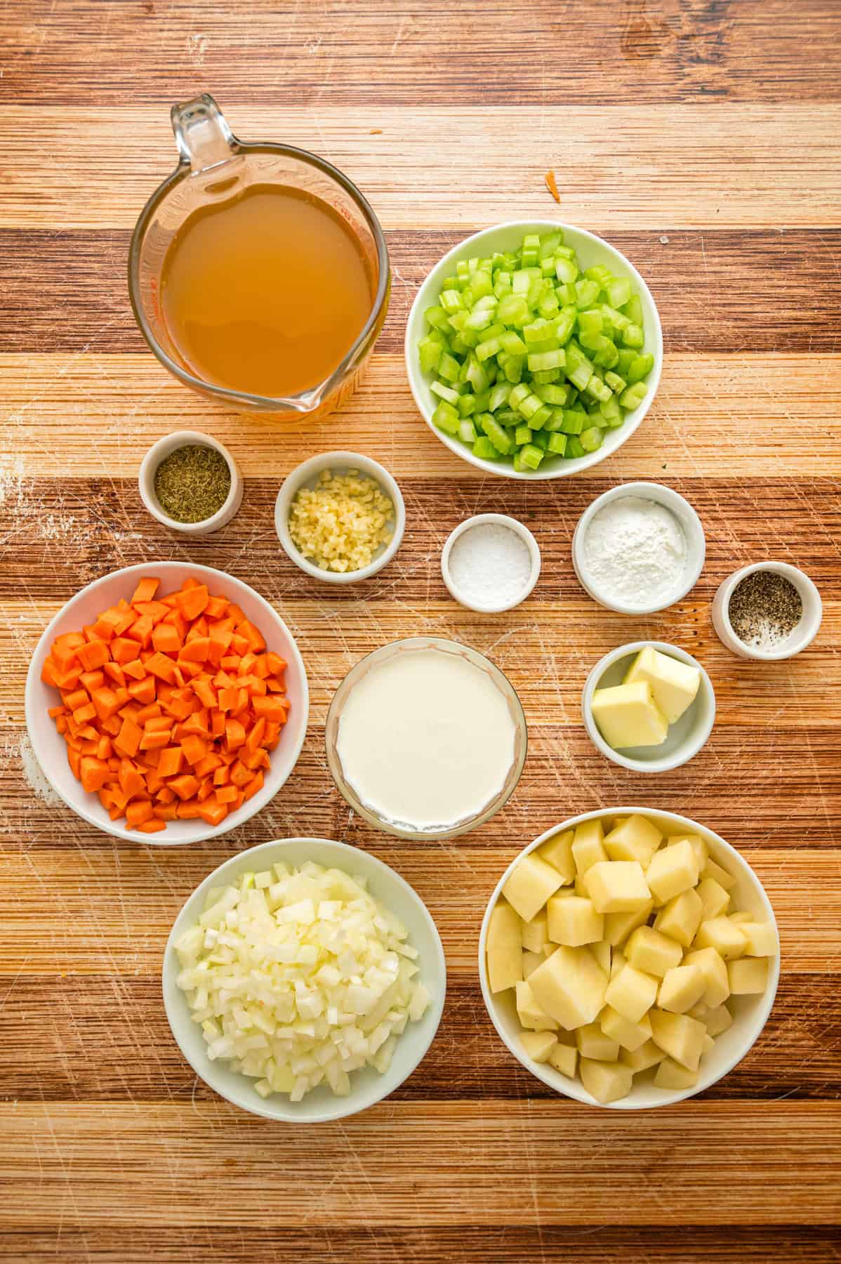 With a creamy base and tender chunks of potato in every bite, this Instant Pot Potato Soup comes together in just 45 minutes. Overhead view of ingredients needed to make potato soup in the instant pot