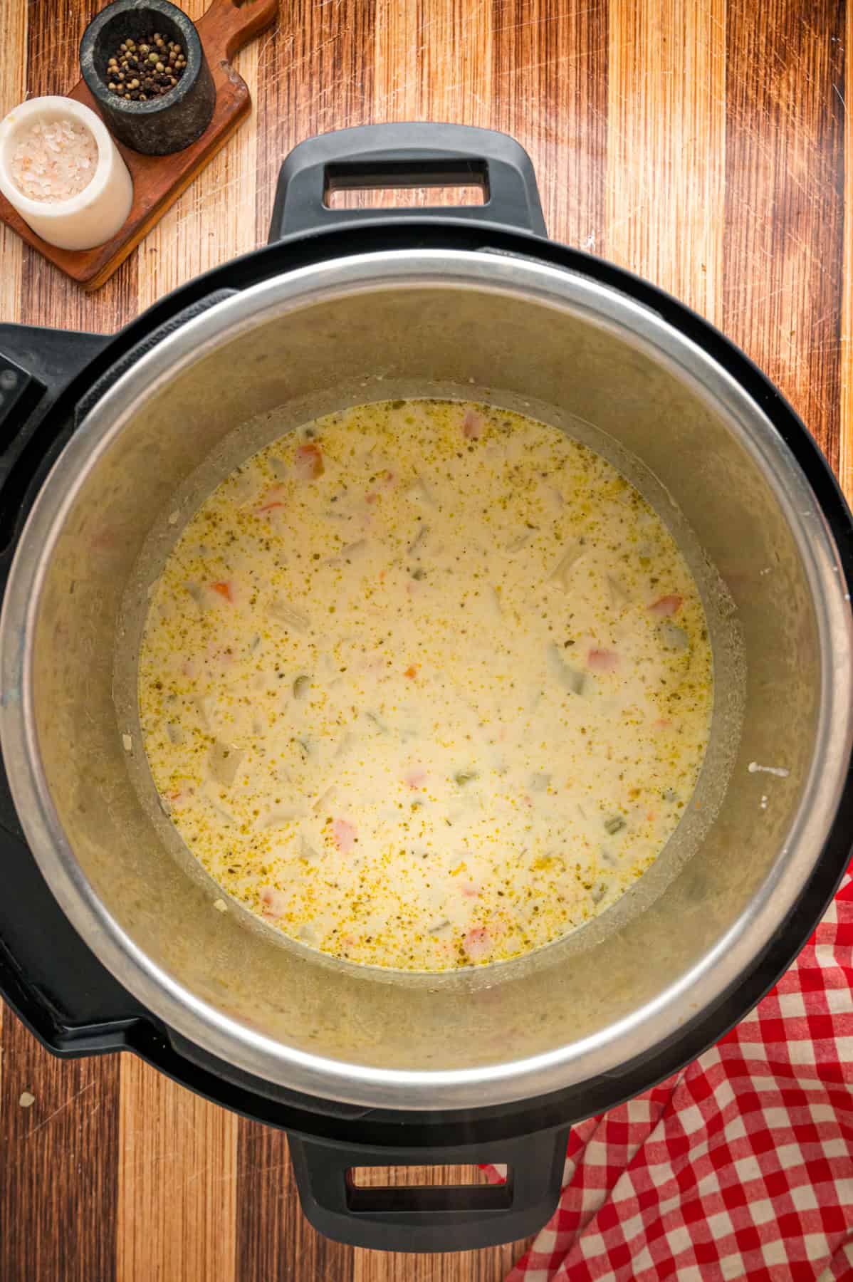 With a creamy base and tender chunks of potato in every bite, this Instant Pot Potato Soup comes together in just 45 minutes. Potato soup in the instant pot before being blended
