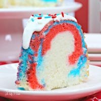 Dazzle your 4th of July guests with a Fireworks Bundt Cake that has a sweet red, white and blue center and is all decked out for the celebration.