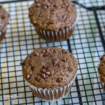 Chocolate chip banana muffins on a wire rack.