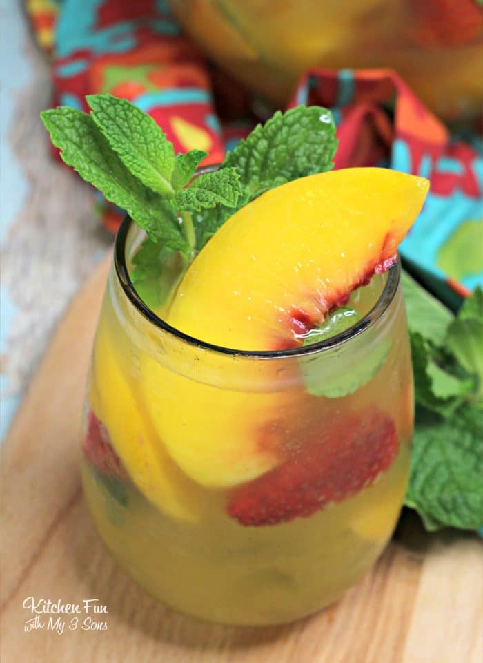 This Peach Sangria recipe is the best around. With white whine, peach nectar and frozen peaches, this will quickly become your favorite summer drink recipe.