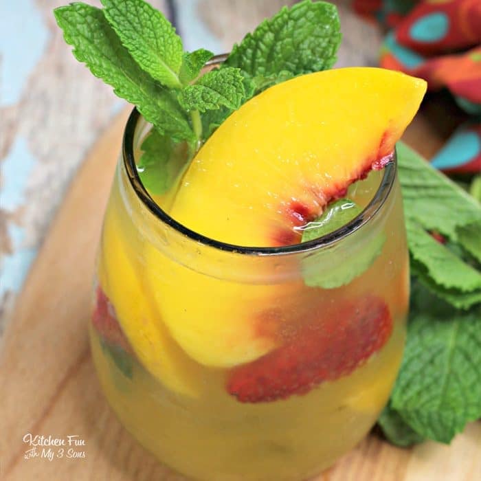 This Peach Sangria recipe is the best around. With white whine, peach nectar and frozen peaches, this will quickly become your favorite summer drink recipe.