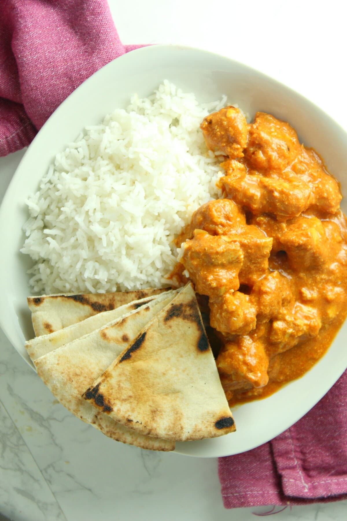 Butter Chicken on a plate with rice